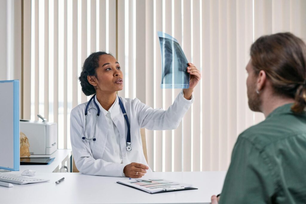 A physiotherapist discussing lung health with a patient in Newmarket.