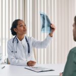 A physiotherapist discussing lung health with a patient in Newmarket.