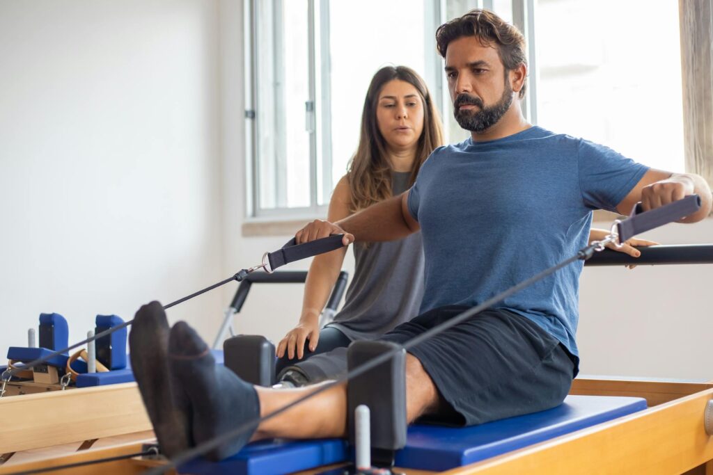 A physiotherapist guiding a client through mobility exercises in Vaughan clinic