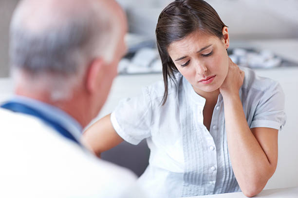 Chiropractor explaining spinal alignment to Newmarket patient