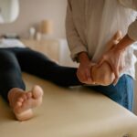 Chiropractor in Newmarket adjusting a patient’s foot for pain relief