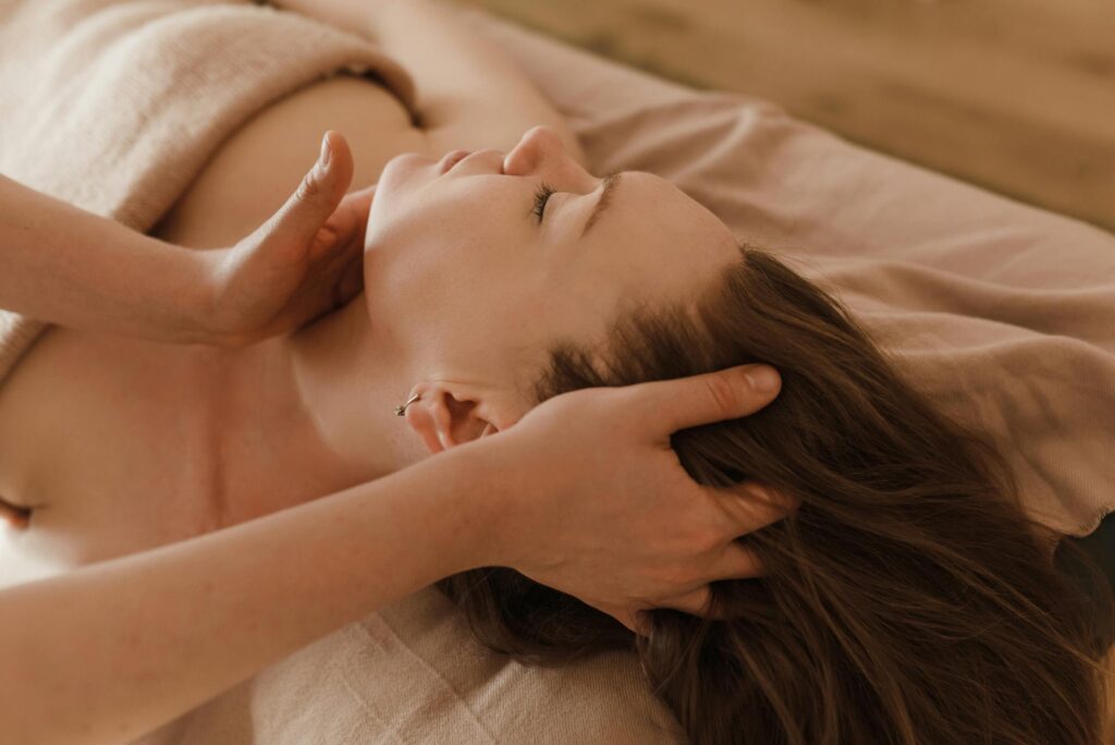 Massage therapist in Vaughan performing neck pain treatment on patient clinic