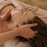Massage therapist in Vaughan performing neck pain treatment on patient clinic
