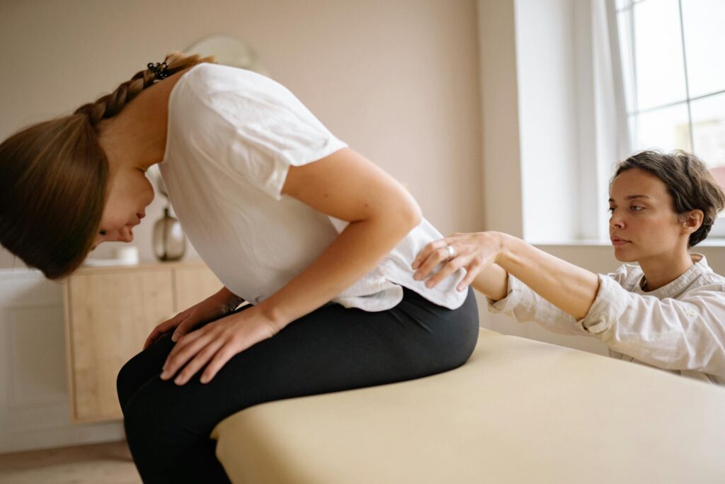 Physiotherapist in Newmarket guiding a spinal cord injury patient