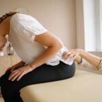 Physiotherapist in Newmarket guiding a spinal cord injury patient
