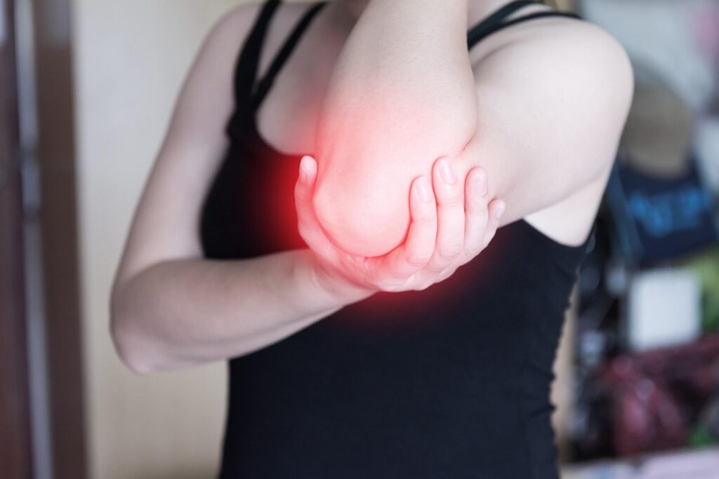 Physiotherapist treating elbow pain in Vaughan clinic