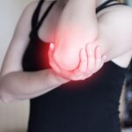 Physiotherapist treating elbow pain in Vaughan clinic