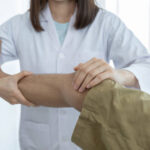 Physiotherapist treating patient with chronic pain at a Newmarket clinic