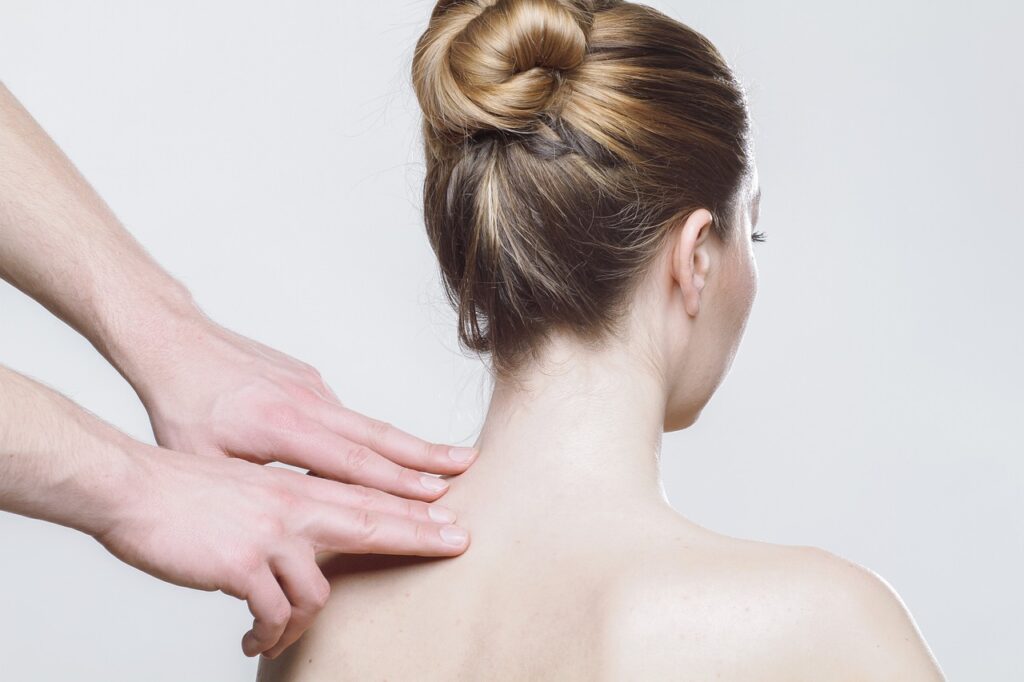 Registered massage therapist relieving neck tension at Vaughan clinic