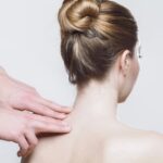 Registered massage therapist relieving neck tension at Vaughan clinic