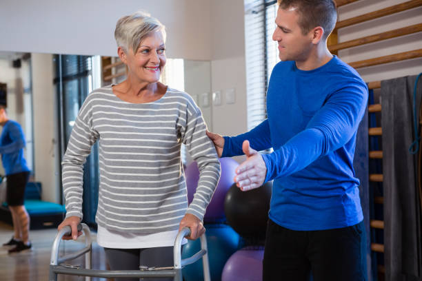 Senior patient working on balance exercises with physiotherapist at Newmarket clinic