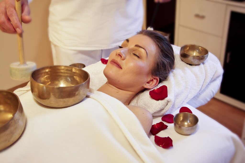 massage therapist relieving migraine tension in a Newmarket clinic