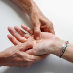 A licensed massage therapist providing wrist pain relief treatment at a Vaughan wellness