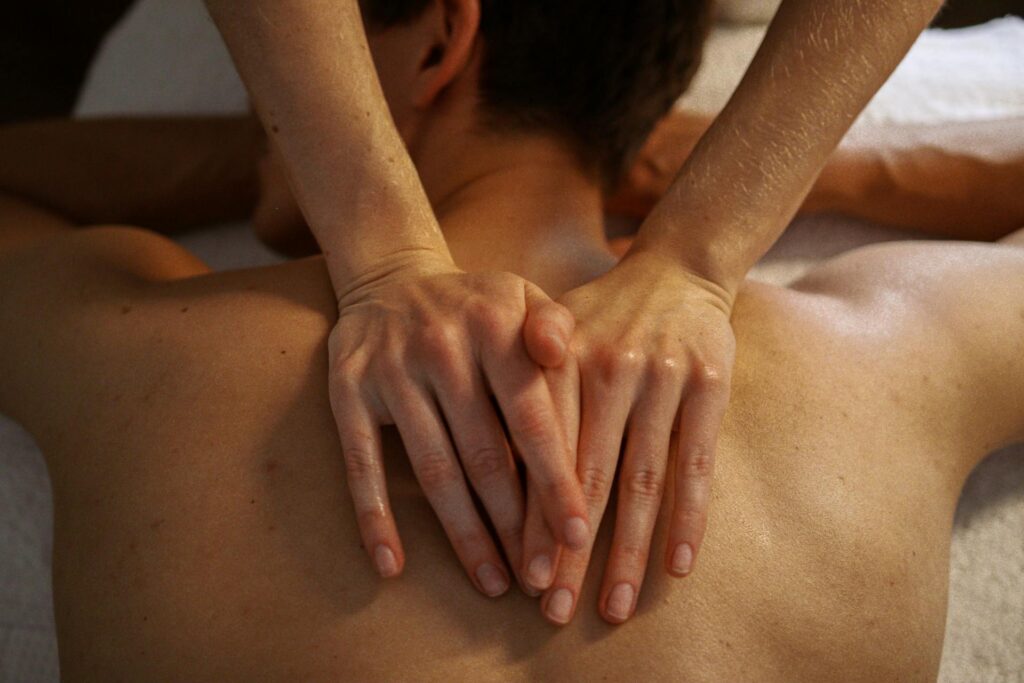 A licensed therapist performing massage therapy for back pain relief in Vaughan at PhysioChiroWellness