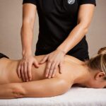 A massage therapist in Vaughan working on a client’s legs to improve blood circulation