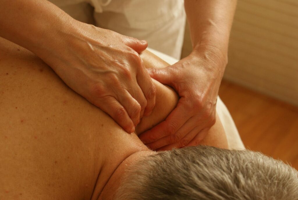 A massage therapist relieving neck pain for a client in Vaughan
