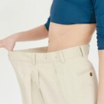 A naturopathic doctor in Newmarket discussing weight loss strategies with a patient