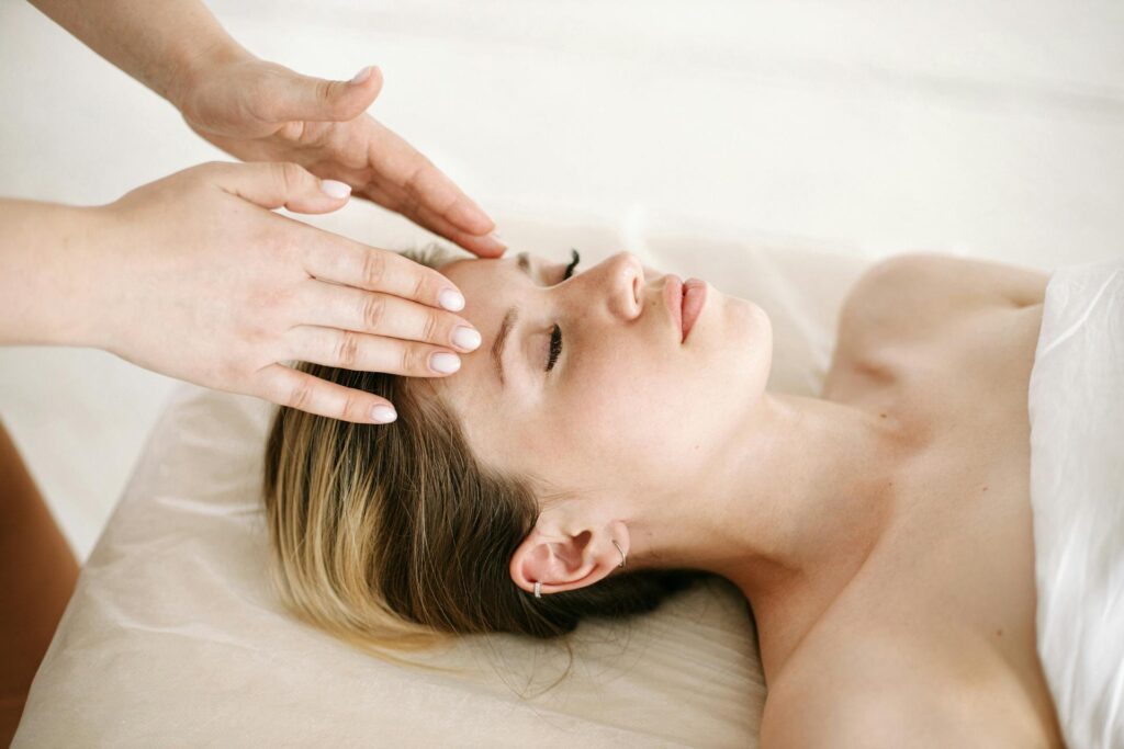 A woman receiving a relaxing massage therapy session in Newmarket for jet lag recovery