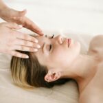 A woman receiving a relaxing massage therapy session in Newmarket for jet lag recovery