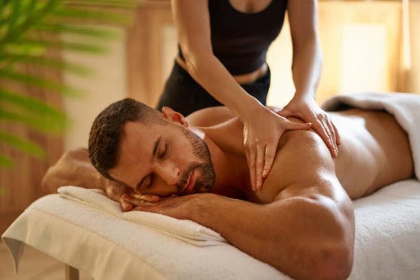Male client receiving massage therapy in Vaughan for stress relief and muscle recovery