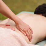 Massage therapist performing relaxation massage for sleep improvement in Newmarket clinic