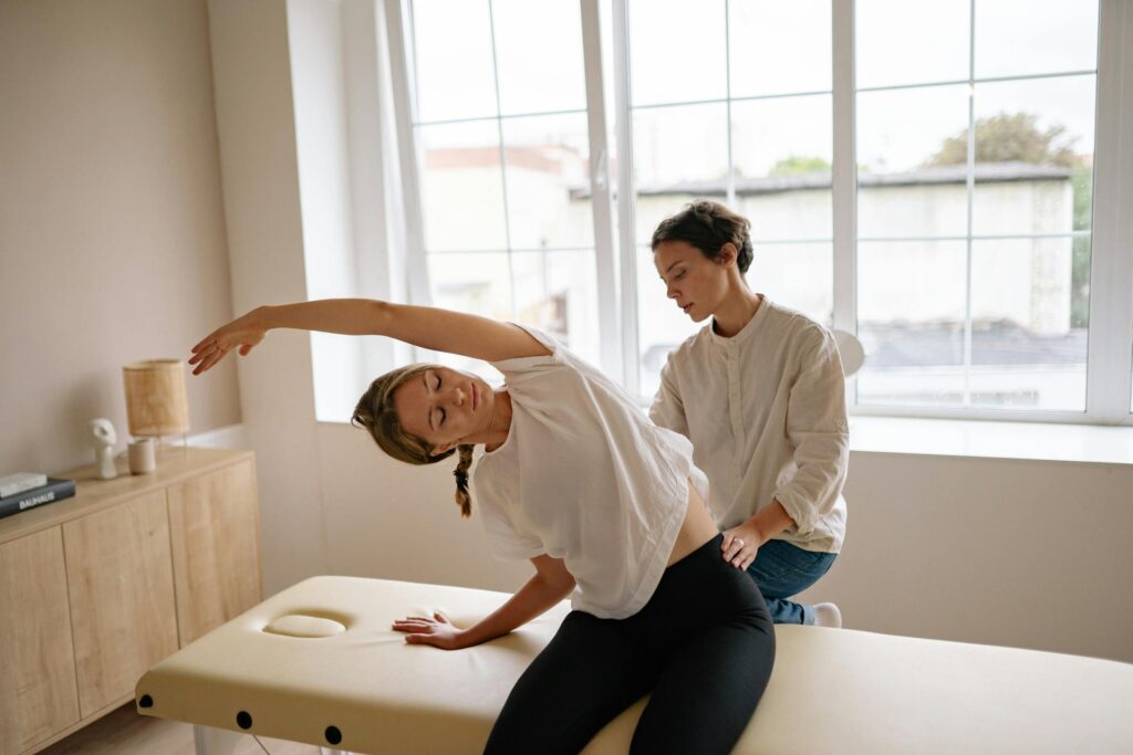 Newmarket chiropractor performing spinal adjustment on patient with chronic back pain