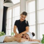 Office worker receiving massage therapy in Vaughan to relieve back pain