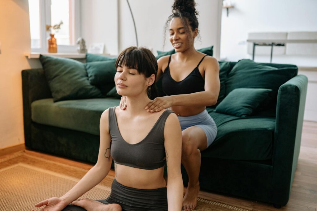 Person receiving relaxing massage therapy to enhance meditation practice in a Newmarket wellness clinic