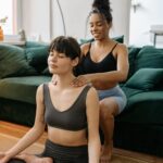 Person receiving relaxing massage therapy to enhance meditation practice in a Newmarket wellness clinic