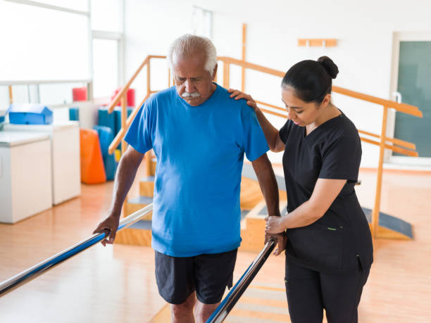 Physiotherapist assisting stroke survivor with walking exercises at a Vaughan rehabilitation clinic