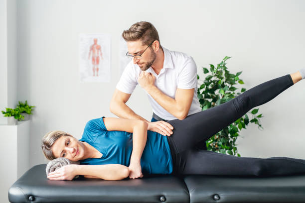 Physiotherapist guiding a patient through hip mobility exercises in Vaughan clinic