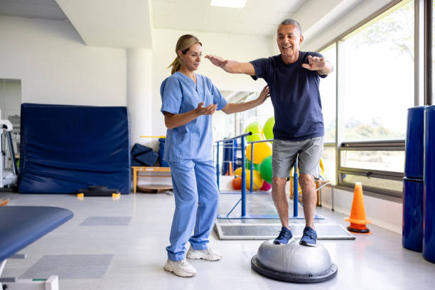 Physiotherapist in Vaughan helping senior client with balance training exercises