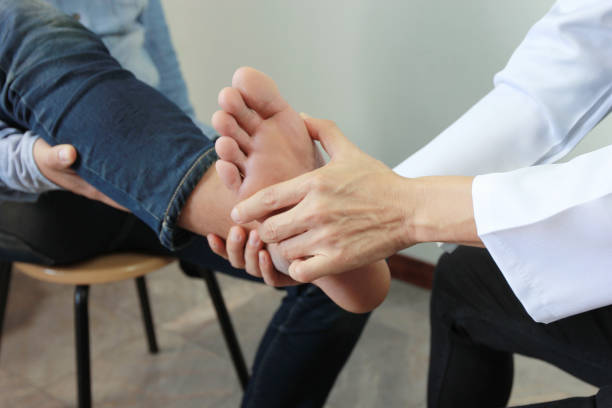Physiotherapist treating a patient’s ankle injury during physiotherapy session in Vaughan clinic