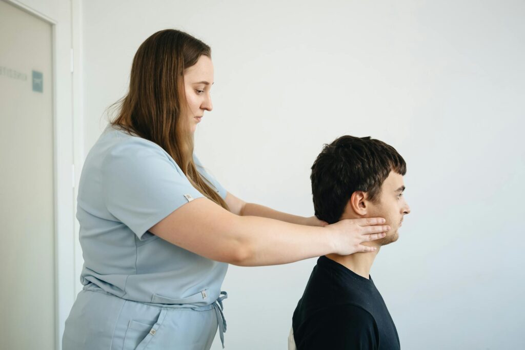 Professional chiropractor in Newmarket performing gentle spinal adjustment on patient