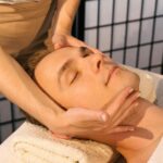 Trauma-informed massage therapist working gently with client in Vaughan clinic