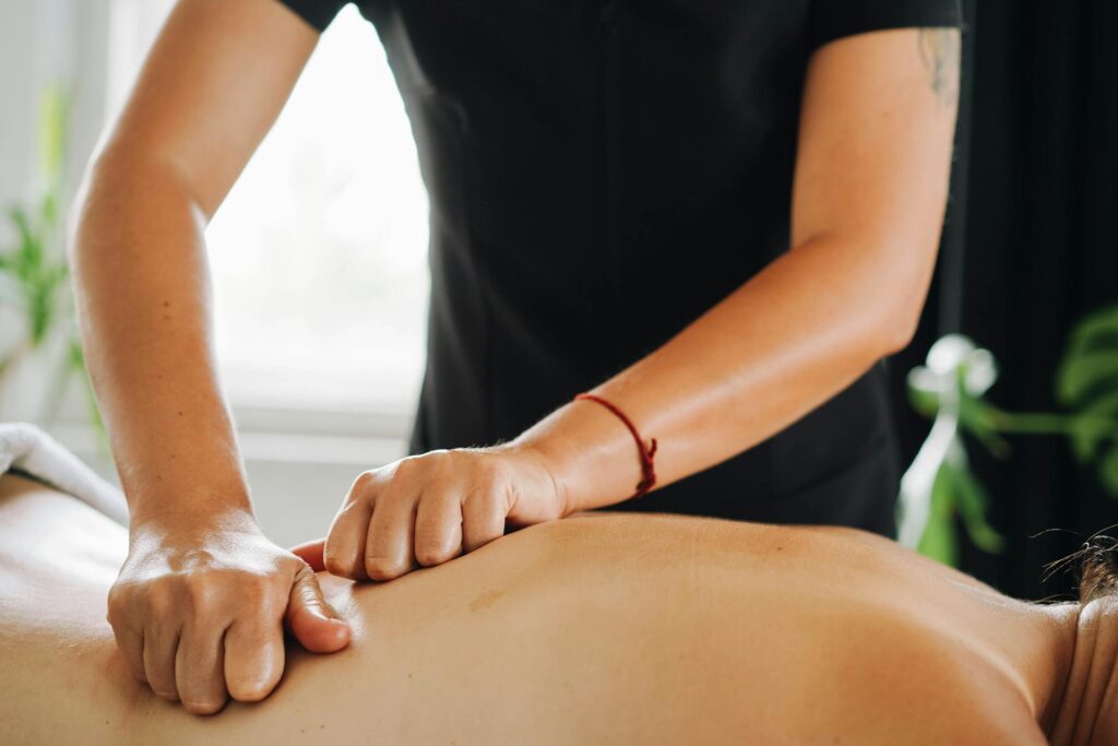 A therapist performing lymphatic drainage massage in Vaughan at PhysioChiroWellness