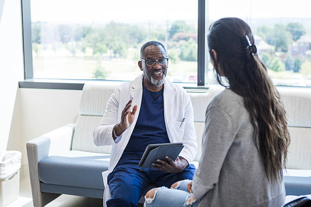 Naturopathic doctor in Vaughan helping a patient start their holistic health journey at PhysioChiroWellness