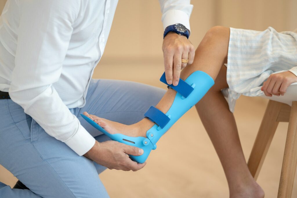 Physiotherapist in Newmarket guiding patient through orthotic-supported rehabilitation exercises