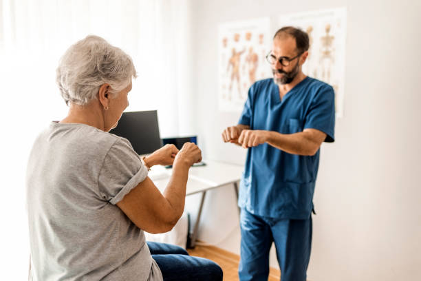 Physiotherapist in Vaughan assisting a senior patient with Parkinson’s in balance training exercises