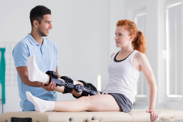 Physiotherapist in Vaughan guiding ACL recovery exercises with patient at PhysioChiroWellness