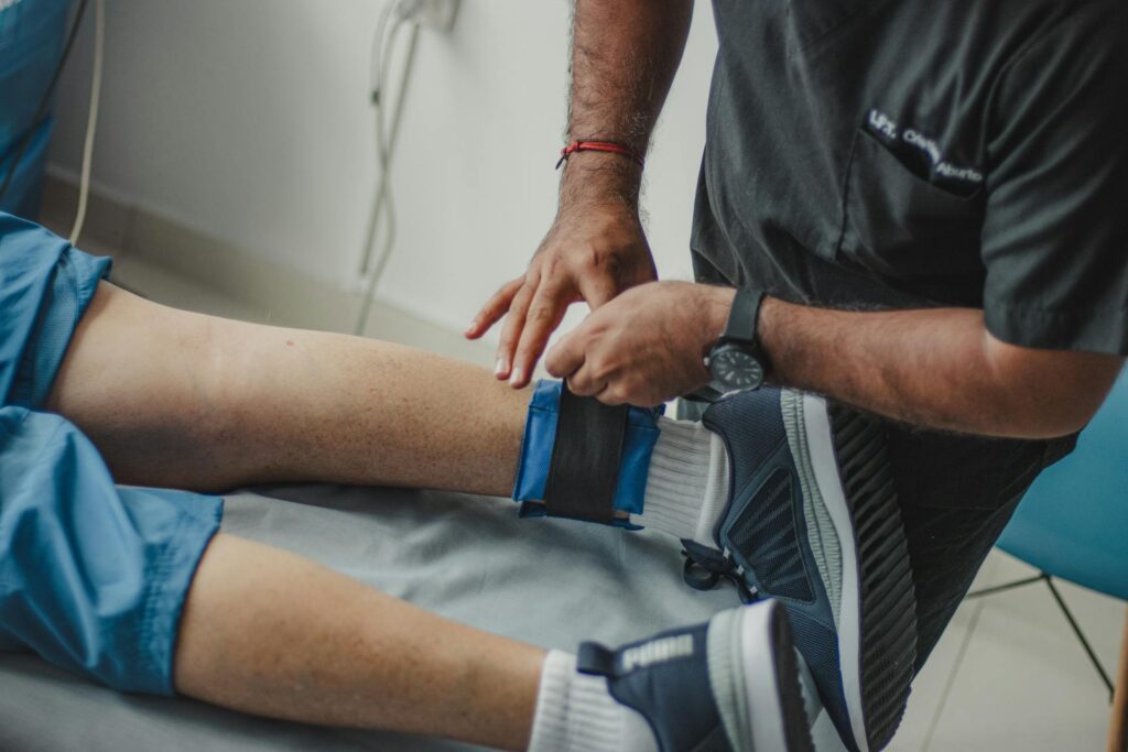 Professional chiropractor in Vaughan adjusting athlete's ankle during sports injury recovery treatment