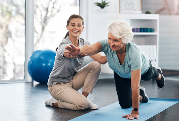 Senior woman in Vaughan practicing balance exercises with a physiotherapist