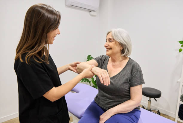 Senior woman receiving gentle chiropractic adjustment from a professional chiropractor in Vaughan at PhysioChiroWellness clinic