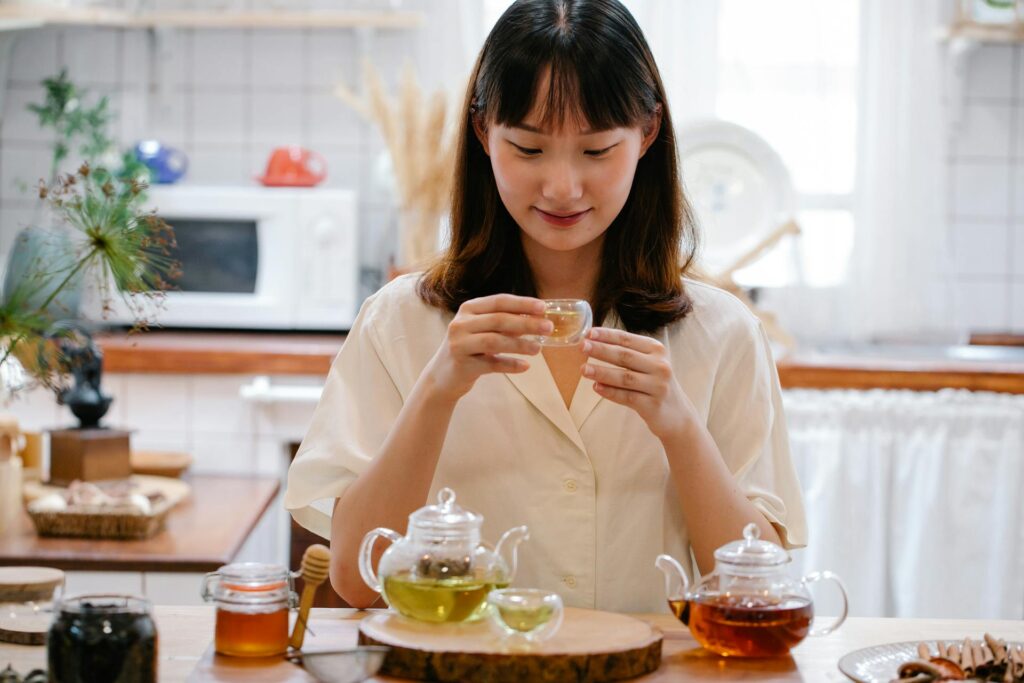Woman sipping herbal detox tea in a peaceful outdoor setting in Vaughan