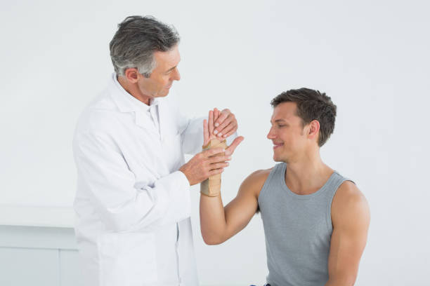 Chiropractor in Vaughan gently adjusting patient’s wrist for pain relief