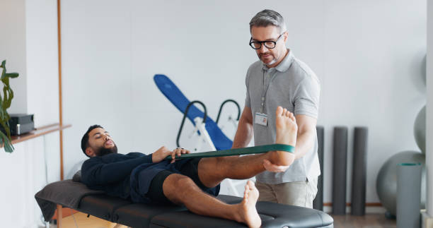 A physiotherapist in Vaughan guides a young athlete through post-injury rehabilitation exercises.