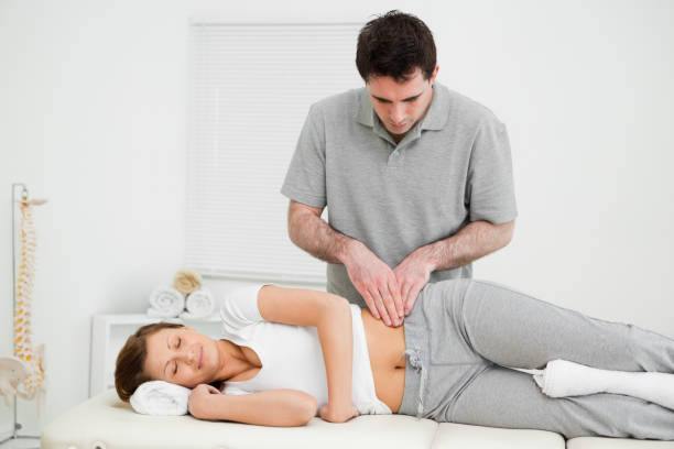 Chiropractor in Newmarket helping patient with pelvic alignment for pain relief