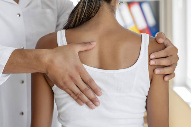 Chiropractor in Newmarket providing gentle spinal adjustment for a patient with scoliosis