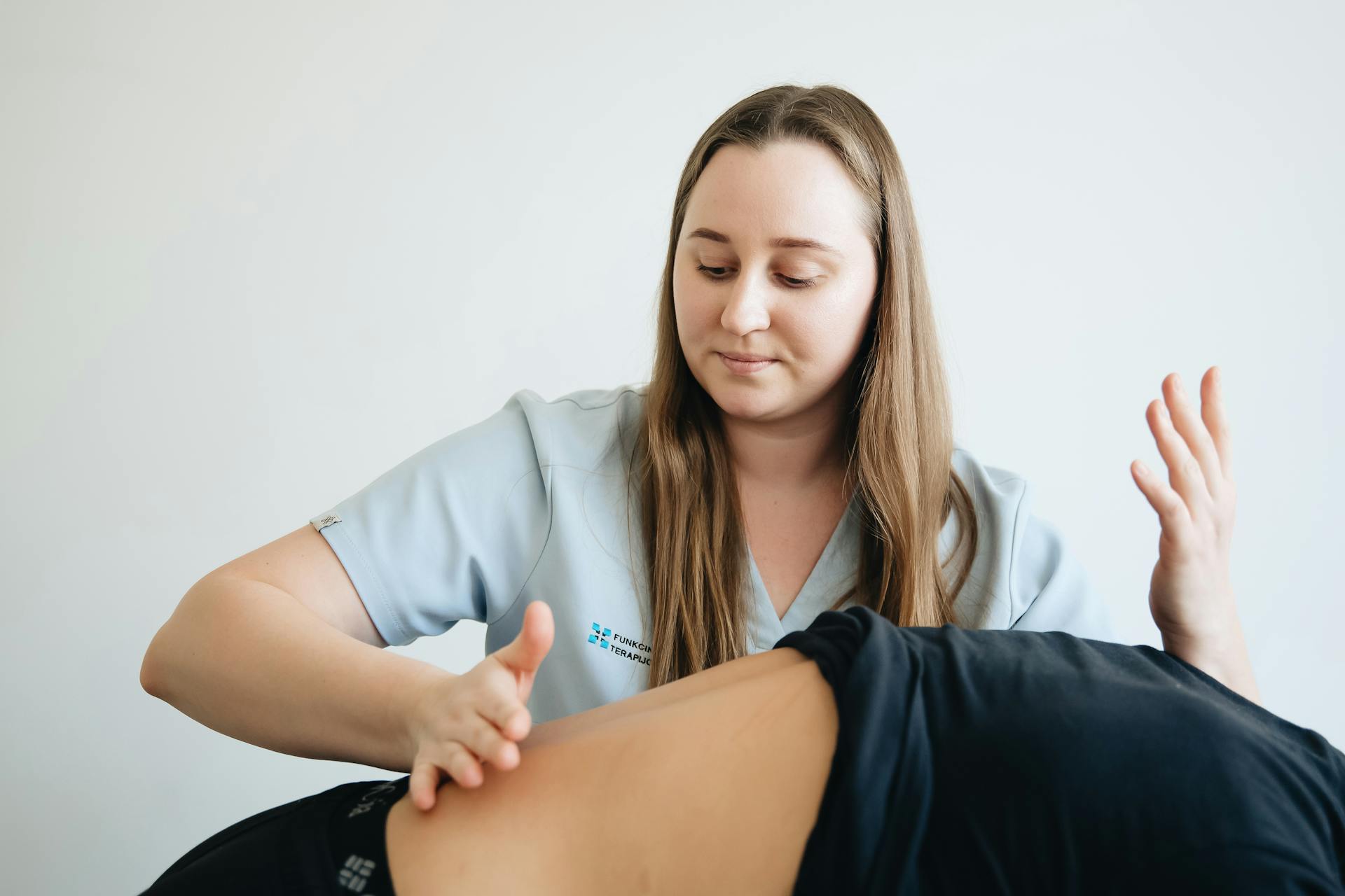 Chiropractor in Vaughan assessing patient with lower back pain during spinal exam Chiropractor in Vaughan assessing patient with lower back pain during spinal exam