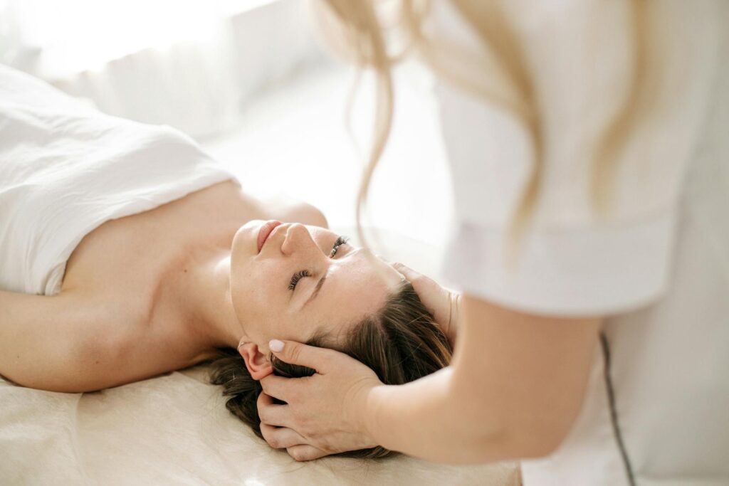Massage therapist in Vaughan gently working on a client’s stiff neck to ease chronic fatigue syndrome joint pain.
